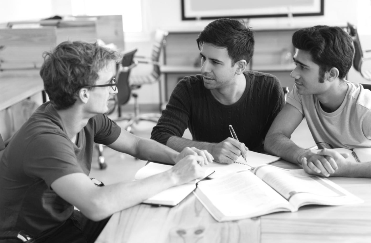 Financial planning session with participants reviewing savings strategies and budget documents